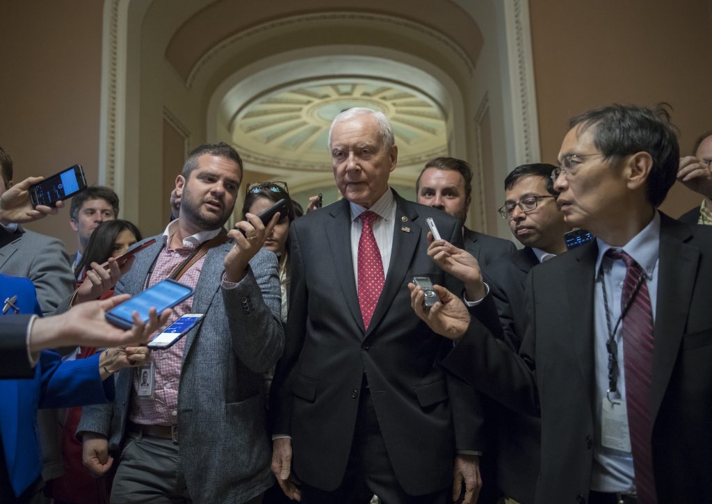Senate Finance Committee Chairman Orrin Hatch, R-Utah, surrounded by reporters in the U.S. Capitol. The committee will hold its hearing on its tax bill next week. Senators aim to pass it out of committee before the Thanksgiving holiday. Senate Finance Committee Chairman Orrin Hatch, R-Utah, surrounded by reporters in the U.S. Capitol. The committee will hold its hearing on its tax bill next week. Senators aim to pass it out of committee before the Thanksgiving holiday.
(J. Scott Applewhite/AP)