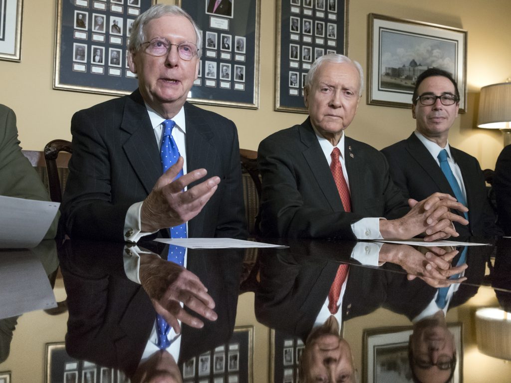 Senate Majority Leader Mitch McConnell, R-Ky., Senate Finance Committee Chairman Orrin Hatch, R-Utah, and Treasury Secretary Steven Mnuchin speak to reporters about the Senate's version of the GOP tax reform bill.
(J. Scott Applewhite/AP)