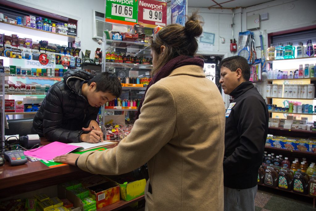 cohen_juntos-community-resistance-zone-10 Gerardo Aguillon Castro (right) and Alana Adams, left, canvass businesses and homes in South Philadelphia as part of a
