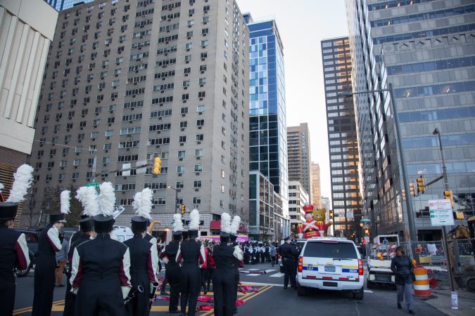 High school marching bands from all over the country line up alongside a heavy police presence at the 98th annual Philadelphia Thanksgiving Day Parade, November 23, 2017. (Emily Cohen for WHYY)
