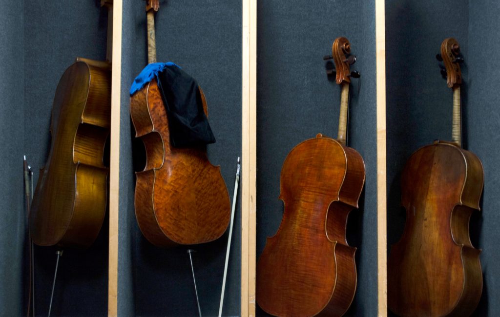 Cellos are lined up backstage at the Chicago Symphony Orchestra before a Nov. 8 rehearsal of Schubert’s Ninth Symphony. The CITES Rosewood regulations have made some musicians apprehensive about taking instruments containing the wood across international borders.