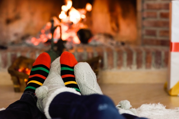 feet-in-christmas-socks-near-fireplace_23-2147578349 Public domain image.