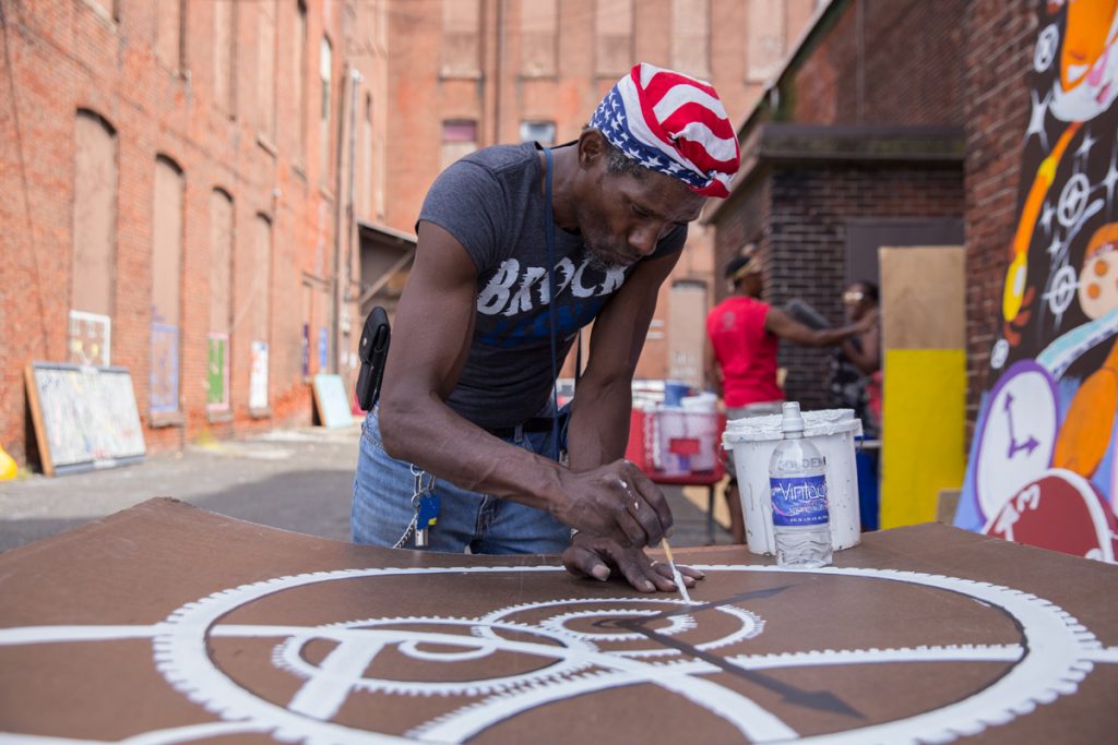 guyton_tyree_02 William Clack, who lives near the abandoned warehouse in Kensington, contributed many panels to the installation. (Lindsay Lazarski/WHYY)