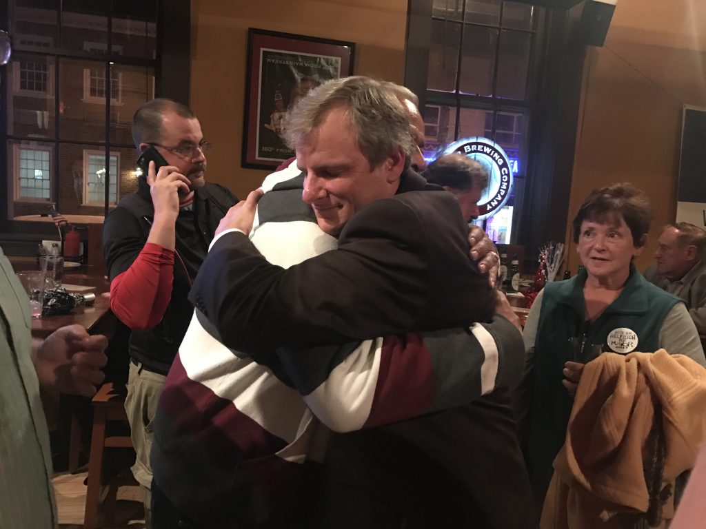 helfrich2 York City Council President Michael Helfrich, a Republican, embraces a supporter after winning the mayor's race. (Emily Previti/WITF)