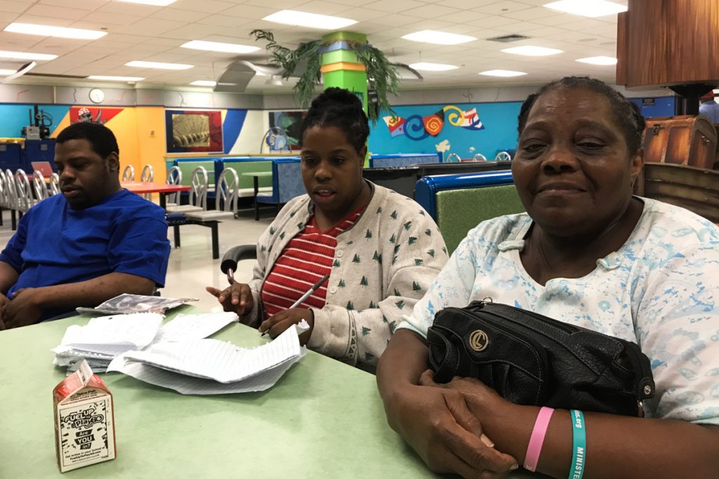 irma José, Nelly and Gloria Guity in the cafeteria of Miami Edison Senior High School the day before Irma hit Miami. (Kate Stein/WHYY)