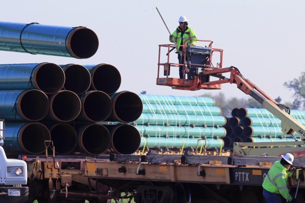 pipeline-construction-620×413 (1) Workers unload pipes at a staging area in Worthing, S.D., for the 1,130-mile Dakota Access Pipeline. A new report says the nation's new natural gas pipeline capacity resulting from a building boom is far more than is needed.