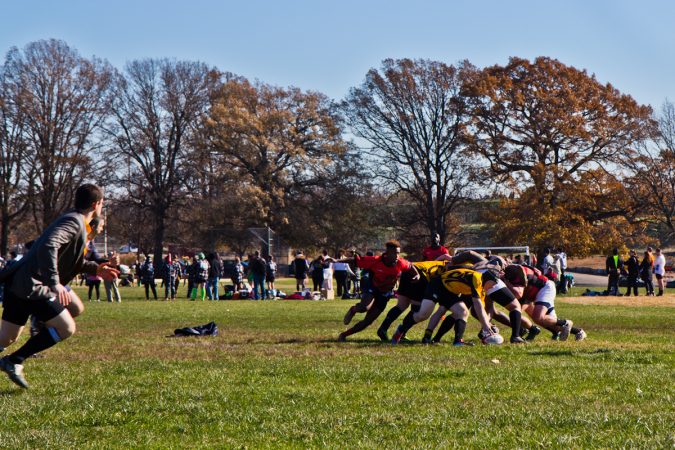 The Rogue Samurai Men battle the Hazbro Blazers at the Apple Pie 7s Rugby Tournament in Fairmount Park. (Kimberly Paynter/WHYY)