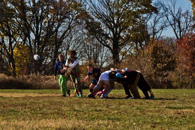 The Handsome Gents battle the Northeast Irish at the Apple Pie 7s Rugby Tournament in Fairmount Park. (Kimberly Paynter/WHYY)
