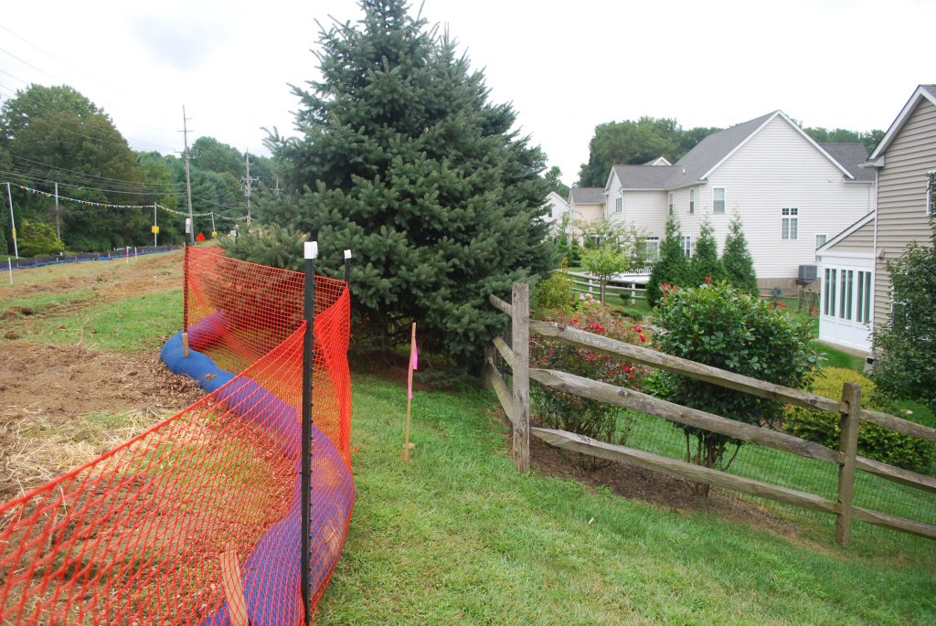 062 An orange fence separates a Delaware County development from a right-of-way for the Mariner East 2 pipeline.