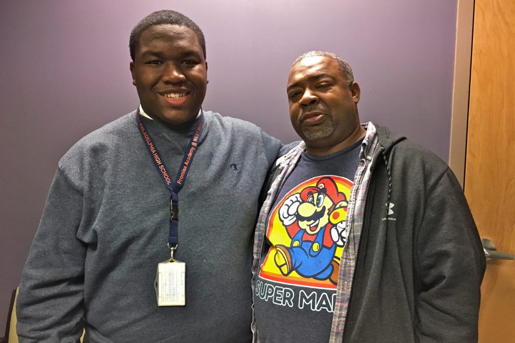 2017 12 18-a hoffman-schitzophrenia teens school parents Ahmad Harrington (left) stands beside his father, James.