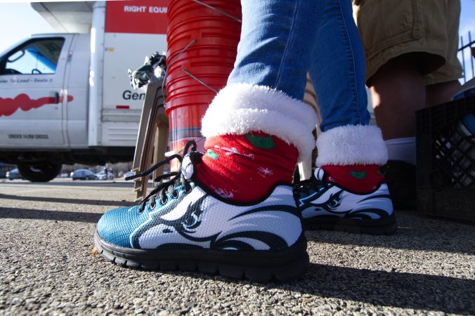 Fans set up to tailgate ahead of the Raiders vs. Eagles Christmas Day game, at the Lincoln Financial Field, on Monday. (Bastiaan Slabbers for WHYY)
