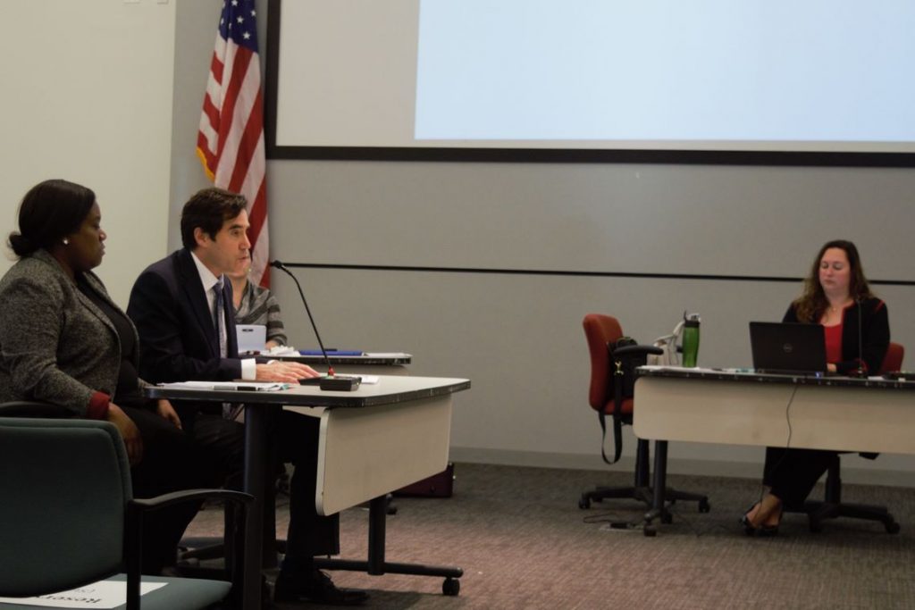 Mastery CEO Scott Gordon speaks during the charter hearings Dec. 18. On his left is Wyneshia Foxworth, the school leader of the proposed charter school. (Greg Windle/The Notebook)