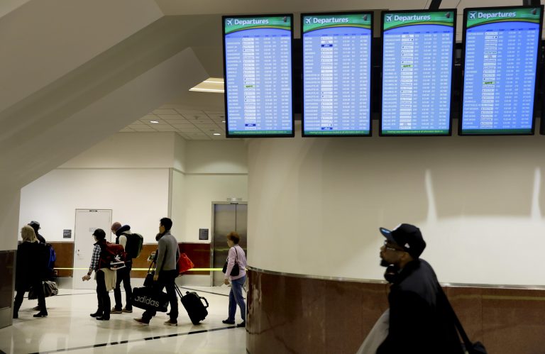 Travelers enter the security line at Hartsfield-Jackson Atlanta International Airport ahead of the Thanksgiving holiday in Atlanta, Wednesday, Nov. 22, 2017. (AP Photo/David Goldman)
