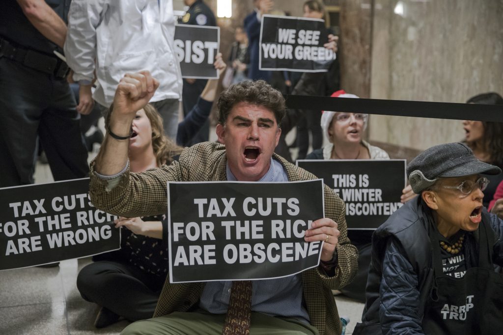 APTOPIX Congress Taxes Protesters shout their disapproval of the Republican tax bill outside the Senate Budget Committee hearing room on Capitol Hill in Washington, Tuesday, Nov. 28, 2017.