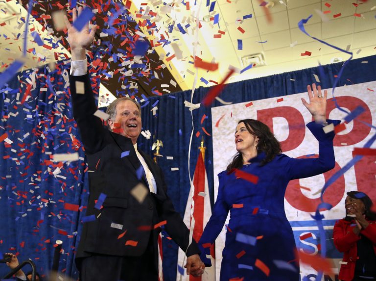 Democratic candidate for U.S. Senate Doug Jones and his wife Louise wave to supporters before speaking Tuesday, Dec. 12, 2017, in Birmingham, Ala. Jones has defeated Republican Roy Moore, a one-time GOP pariah who was embraced by the Republican Party and the president even after facing allegations of sexual impropriety.