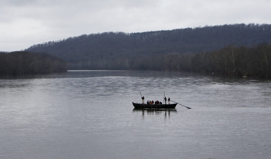 Washington’s Crossing FILE- In this Dec. 25, 2015, file photo, a group of Revolutionary War re-enactors row a Durham boat during the re-enactment of Washington crossing the Delaware River, in Washington Crossing, Pa. Re-enactors might not be able to make their annual Christmas Day trip across the Delaware River between Pennsylvania and New Jersey because low water levels make it impossible for them to navigate their wooden Durham boats.