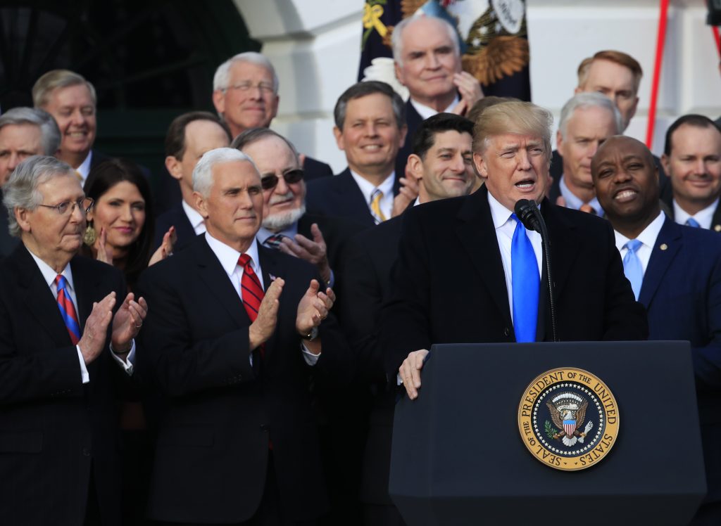 Donald Trump, Mike Pence, Paul Ryan, Mitch McConnell, Tim Scott President Donald Trump, with, from left, Senate Majority Leader Mitch McConnell of Ky., Vice President Mike Pence, House Speaker Paul Ryan of Wis., and Sen. Tim Scott, R-S.C., speaks about the passage of the tax bill on the South Lawn at the White House in Washington, Wednesday, Dec. 20, 2017.