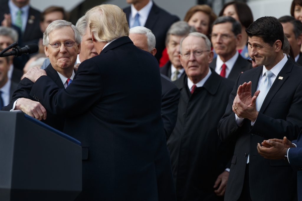 Donald Trump, Paul Ryan, Mitch McConnell Speaker of the House Paul Ryan, R-WIs., right, applauds as President Donald Trump hugs Senate Majority Leader Mitch McConnell, R-Ky., as he speaks during an event on the South Lawn of the White House in Washington, Wednesday, Dec. 20, 2017, to acknowledge the final passage of tax overhaul legislation by Congress.