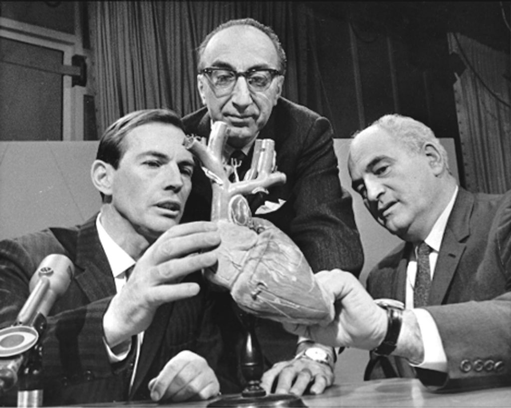 barnard, DeBakey, Kantrowitz *** FILE *** Dr. Christian Barnard of South Africa, Dr. Michael DeBakey of Huston, Tex. center, USA, and Dr. Adrian Kantrowitz of Brooklyn, N.Y., right, confer Dec. 24, 1967 in Washington, before appearing on the CBS television program