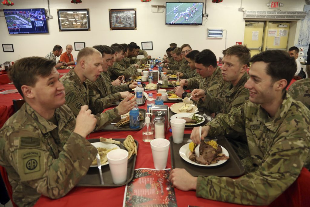 Afghanistan Christmas Members of the U.S. military eat Christmas dinner at the Resolute Support Headquarters in Kabul, Afghanistan, Monday, Dec. 25, 2017. (Rahmat Gul/AP Photo)