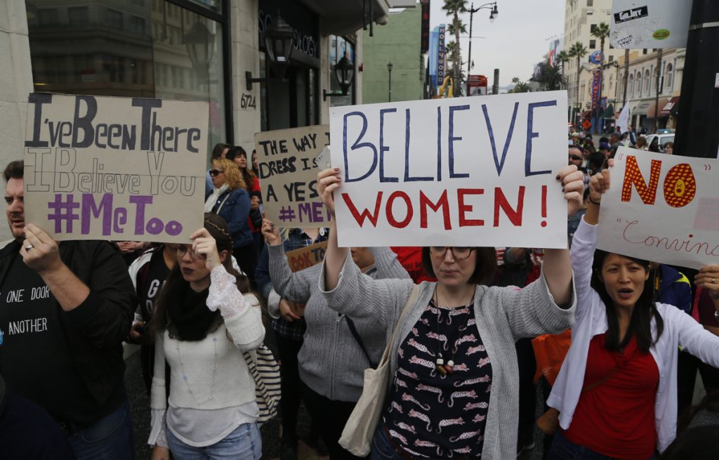 Participants march against sexual assault and harassment at the #MeToo March in the Hollywood section of Los Angeles on Sunday, Nov. 12, 2017.  (Damian Dovarganes/AP Photo)
