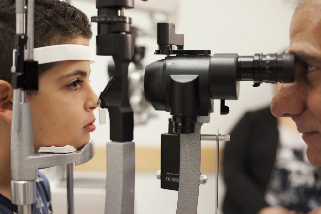 MED–Genetic Frontiers-Blindness-Gene Therapy In this Oct. 4, 2017, file photo, Dr. Albert Maguire, right, checks the eyes of Misa Kaabali, 8, at the Children's Hospital of Philadelphia. Misa was 4-years-old when he received his gene therapy treatment. On Tuesday, Dec. 19, 2017, the Food and Drug Administration approved the therapy which improves the vision of patients with a rare form of inherited blindness, another major advance for the burgeoning field of genetic medicine. (Bill West/AP Photo, file)