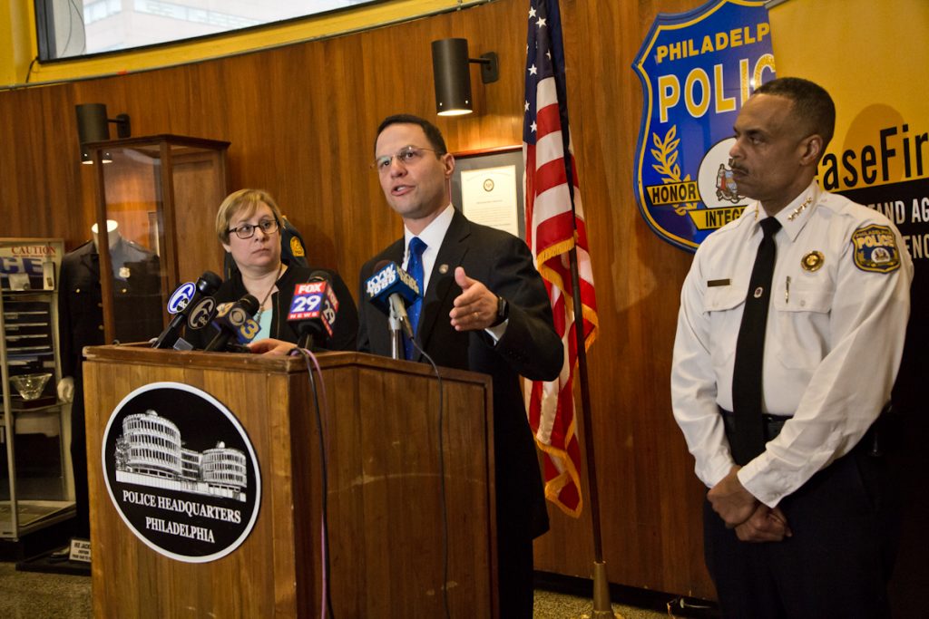 CONCEALED CARRY PRESSER Pennsylvania Attorney General Josh Shapiro (center), Shira Goodman, CeaseFire PA executive director, (left) and Philadelphia Police Commissioner Richard Ross (right) held a press conference at police headquarters Tuesday to express concern over concealed carry reciprocity. (Kimberly Paynter/WHYY)