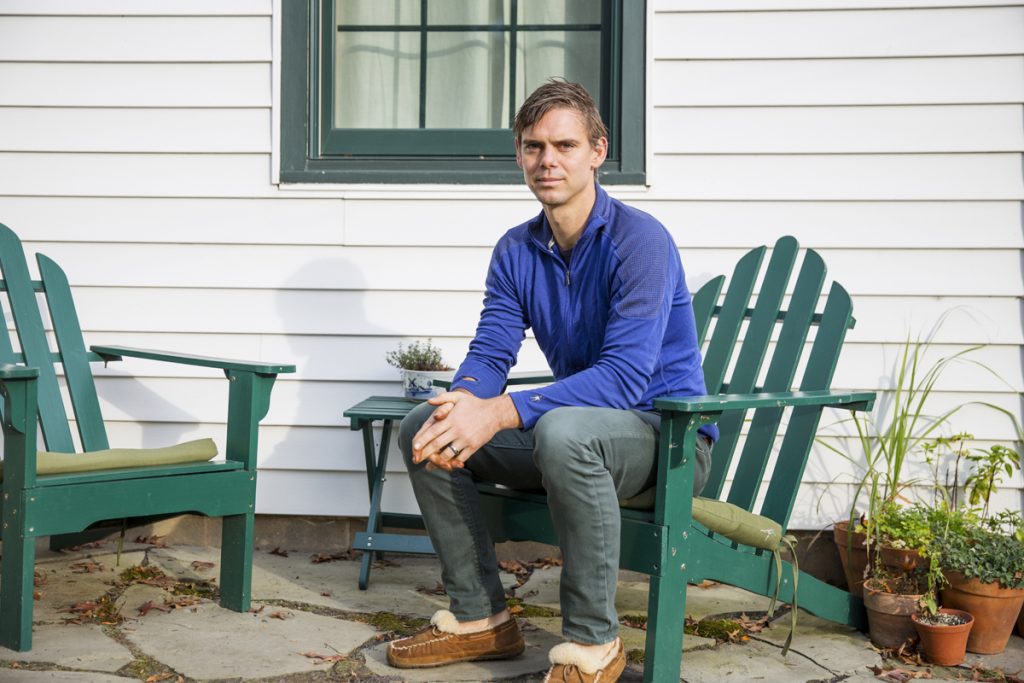 MOBILE HOME PARK 01 Matt Rooke sits outside of his home in State College, Pennsylvania. A former resident at the Hilltop Mobile Home Park, Rooke said his experience of being displaced gave him insights of the affordable housing problem in the area. (Min Xian/Keystone Crossroads)