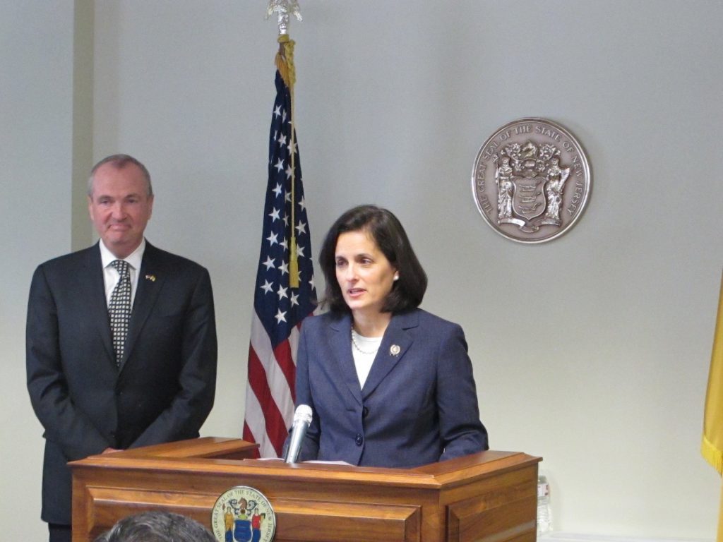 Muoio Assemblywoman Liz Muoio, standing with Gov.-elect Phil Murphy, says she's looking forward to being confirmed as New Jersey state treasurer. (Phil Gregory/WHYY)