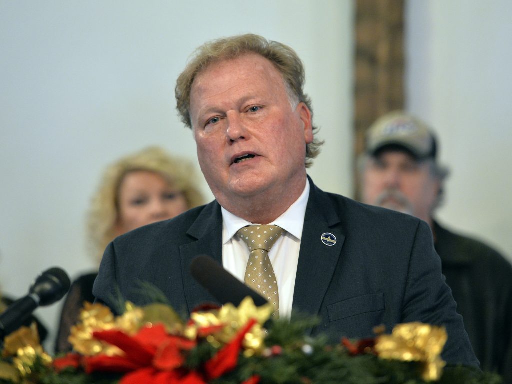 With friends and family standing behind him, Kentucky State Rep., Republican Dan Johnson addresses the public from his church on Tuesday to defend himself against accusations of sexual assaulting a 17-year-old girl in 2012. With friends and family standing behind him, Kentucky State Rep., Republican Dan Johnson addresses the public from his church on Tuesday to defend himself against accusations of sexual assaulting a 17-year-old girl in 2012.