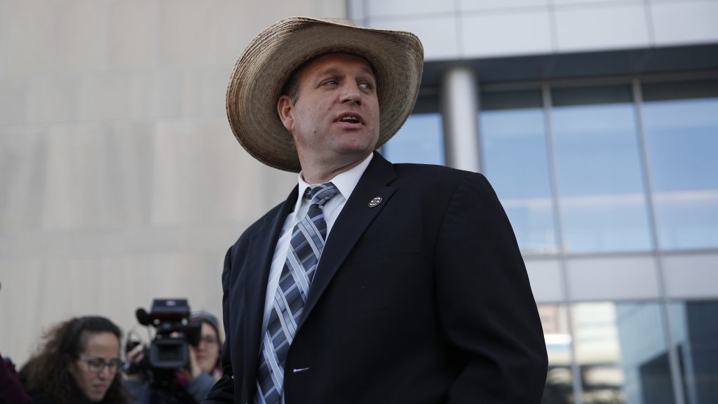 Ammon Bundy walks out of a federal courthouse in Las Vegas on Wednesday. U.S. District Judge Gloria Navarro declared a mistrial in the case against Cliven Bundy, his sons Ryan and Ammon, and self-styled Montana militia leader Ryan Payne.