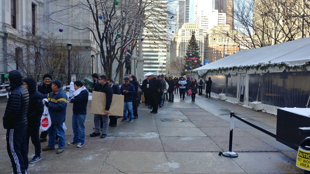 asian Stop and go owners line up to get into City Hall (Tom MacDonald, WHYY)