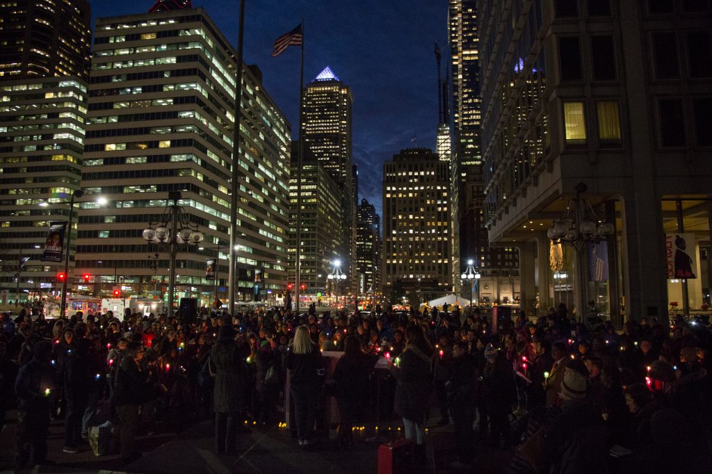 cohen-homeless_memorial_2017 Hundreds of Philadelphians gather at Thomas Paine Plaza to remember the those homeless and formerly homeless Philadelphians who died in 2017 and to call for an end to homelessness on December 21, 2017. (Emily Cohen for WHYY)