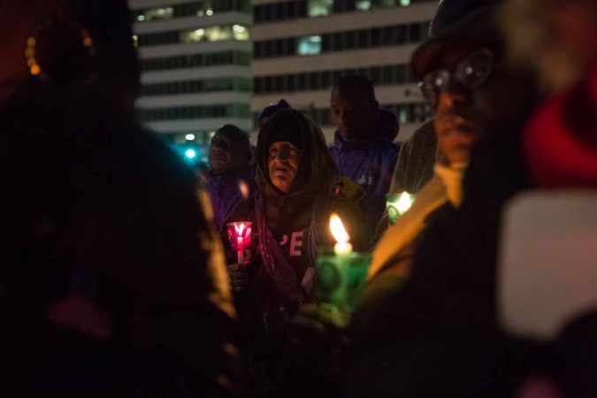 Hundreds of Philadelphians gather at Thomas Paine Plaza to remember the those homeless and formerly homeless who died in 2017 and to call for an end to homelessness on December 21, 2017. (Emily Cohen for WHYY)