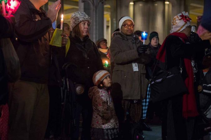 Hundreds of Philadelphians gather at Thomas Paine Plaza to remember the those homeless and formerly homeless people in Philadelphia who died in 2017. They also called for an end to homelessness. (Emily Cohen for WHYY)