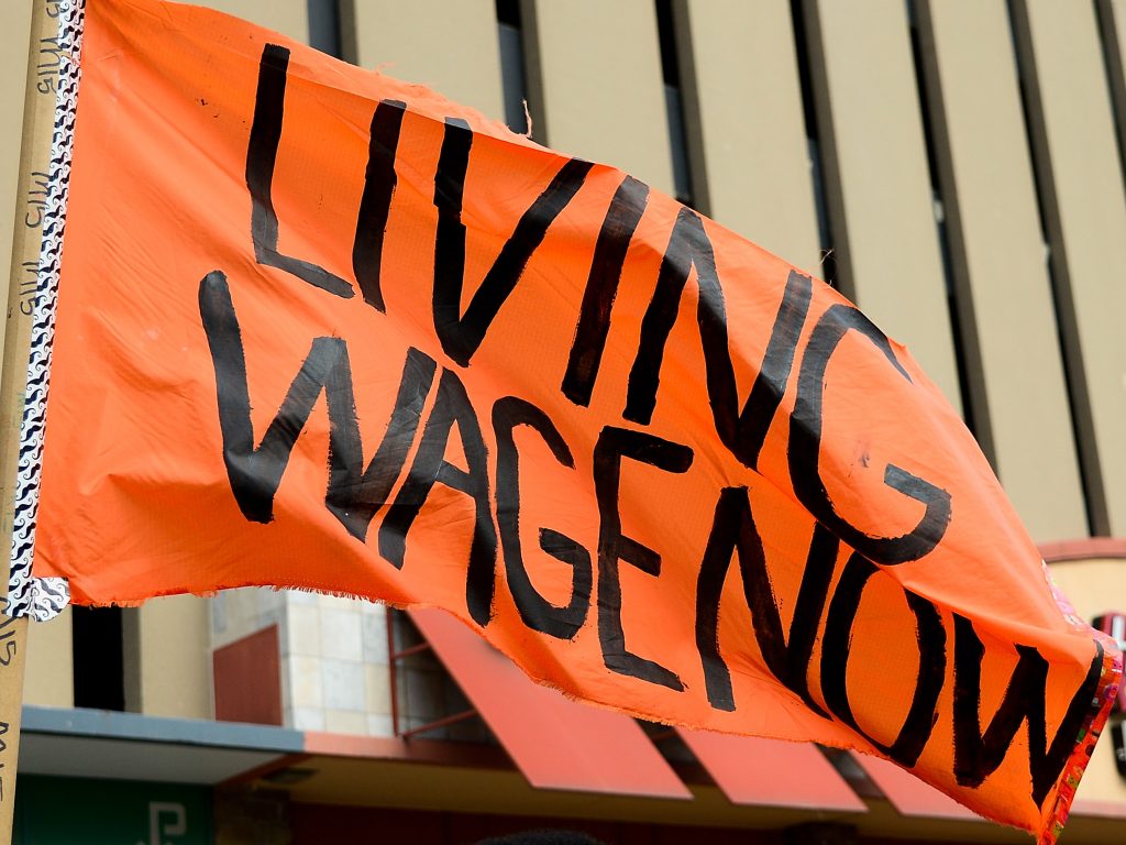 Protesters rally outside a restaurant in St. Louis on Feb. 13. The service industry employs the largest percentage of minimum wage workers. Protesters rally outside a restaurant in St. Louis on Feb. 13. The service industry employs the largest percentage of minimum wage workers. (Jeff Curry/Getty Images)