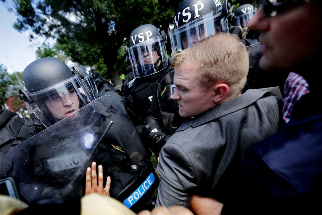 White nationalists clash with police as they are forced out of Emancipation Park after the “Unite the Right” rally Aug. 12 in Charlottesville, Va. White nationalists clash with police as they are forced out of Emancipation Park after the