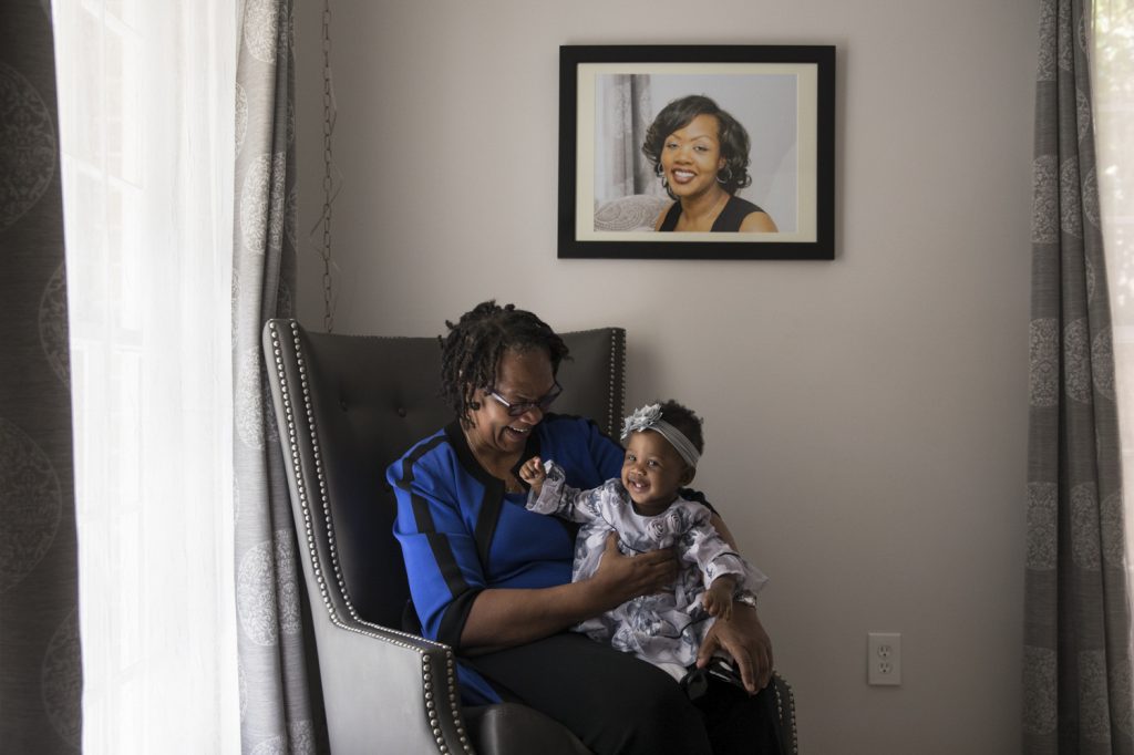 Wanda Irving holds her granddaughter, Soleil, in front of a portrait of Soleil’s mother, Shalon, at her home in Sandy Springs, Ga. Wanda is raising Soleil since Shalon died of complications due to hypertension a few weeks after giving birth. Wanda Irving holds her granddaughter, Soleil, in front of a portrait of Soleil's mother, Shalon, at her home in Sandy Springs, Ga. Wanda is raising Soleil since Shalon died of complications due to hypertension a few weeks after giving birth. (Becky Harlan/NPR)