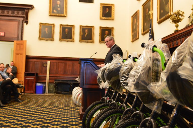 Mayor Jim Kenney speaks before giving away new bikes Wednesday at a City Hall ceremony. (Tom MacDonald/WHYY)