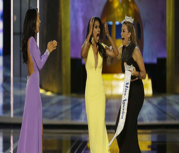 Miss New York Nina Davuluri, center, reacts after being named Miss America 2014 pageant as Miss California Crystal Lee, left, and Miss America 2013 Mallory Hagan celebrate with her, Sunday, Sept. 15, 2013, in Atlantic City, N.J. (Mel Evans/AP Photo)