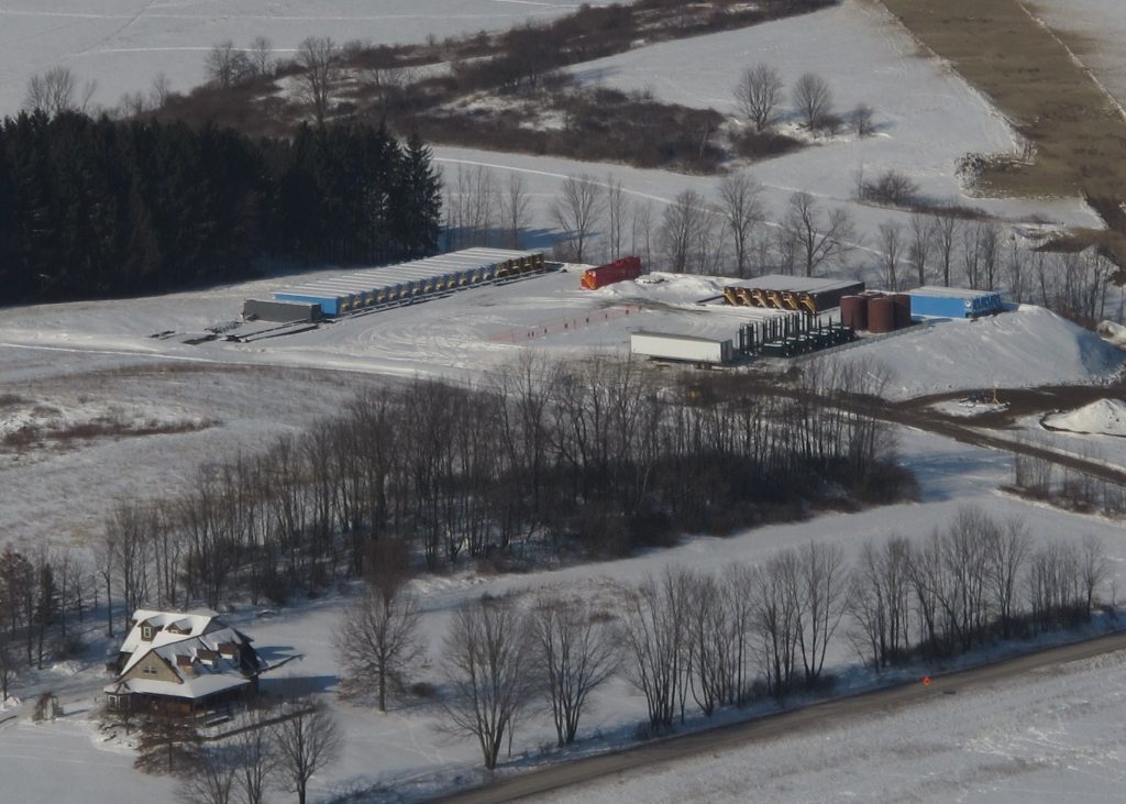 pad-3 A natural gas well pad in central Pennsylvania, with a home in the foreground. A new study shows infants born to mothers living within a half mile of active fracking sites have a higher risk of low birth weights compared to those living further away. (Scott Detrow/StateImpact Pennsylvania)
