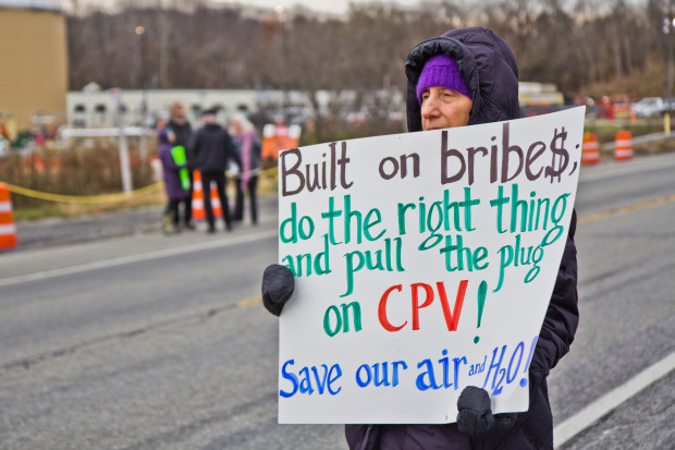 protestors-and-gas-plant-3-620×413 Roz Gitt from Warwick, New York, protests in front of the construction site for the new CPV natural gas plant in Wawayanda. The plant would run on Pennsylvania's Marcellus Shale gas.