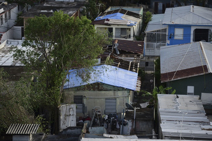 Hurricane Failed Help In this Nov. 15, 2017 photo, some roofs damaged by Hurricane Maria have awnings installed in El Gandúl neighborhood, in San Juan, Puerto Rico. A newly created Florida company with an unproven record won more than $30 million in contracts from the Federal Emergency Management Agency to provide emergency tarps and plastic sheeting for repairs to hurricane victims in Puerto Rico. Bronze Star LLC never delivered those urgently needed supplies, which even months later remain in demand on the island. (AP Photo/Carlos Giusti)