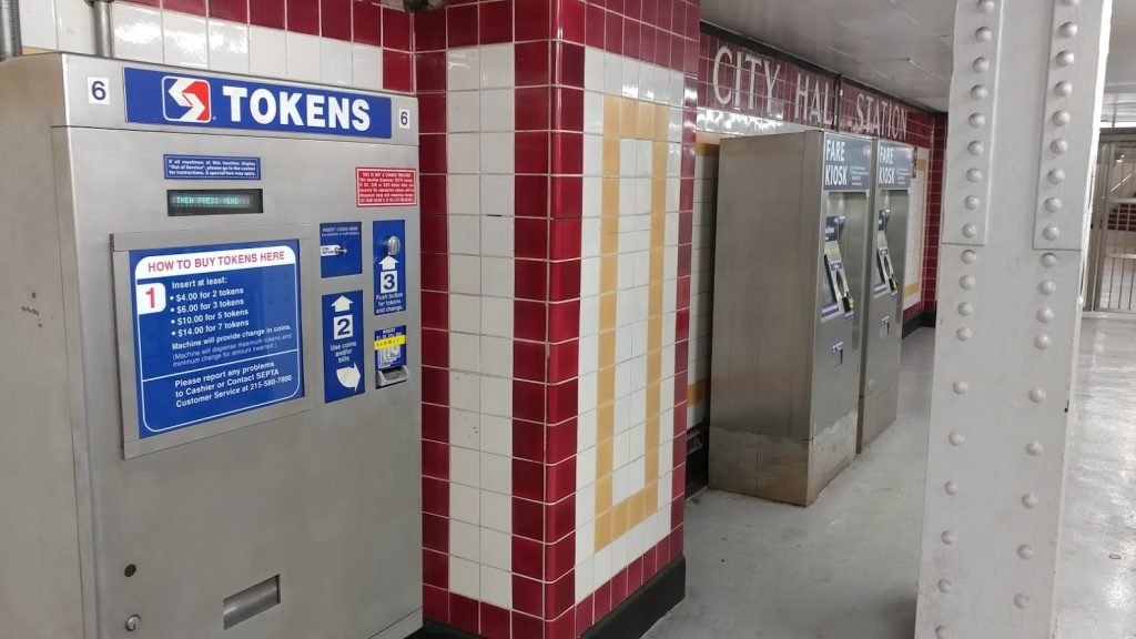 token-key A SEPTA token machine (left) will eventually be taken out of service as the electronic Key fare cards, sold at right, gain popularity. (Tom MacDonald/ WHYY)