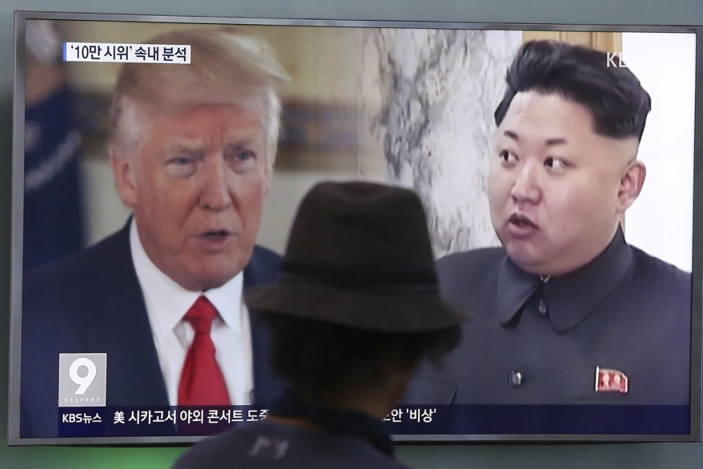 A TV screen shows U.S. President Donald Trump and North Korean leader Kim Jong Un during a news program in Seoul, South Korea.