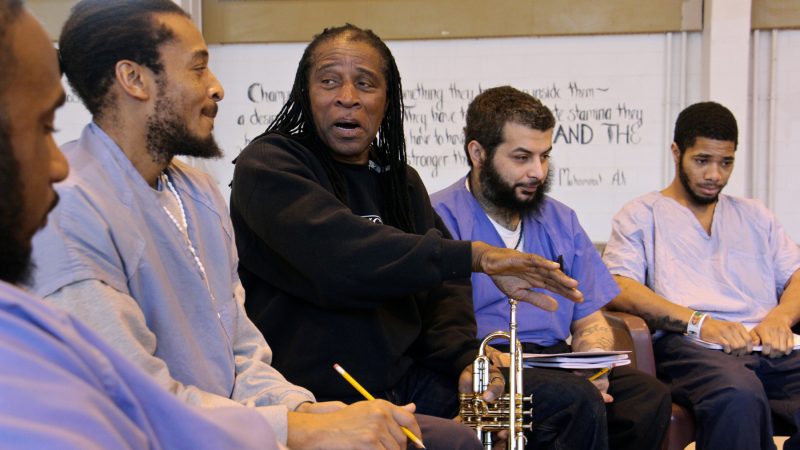 Philadelphia Orchestra composer-in-residence Hannibal Lokumbe meets with inmates at Philadelphia Detention Center, an experience that will inform his work. (Emma Lee/WHYY)