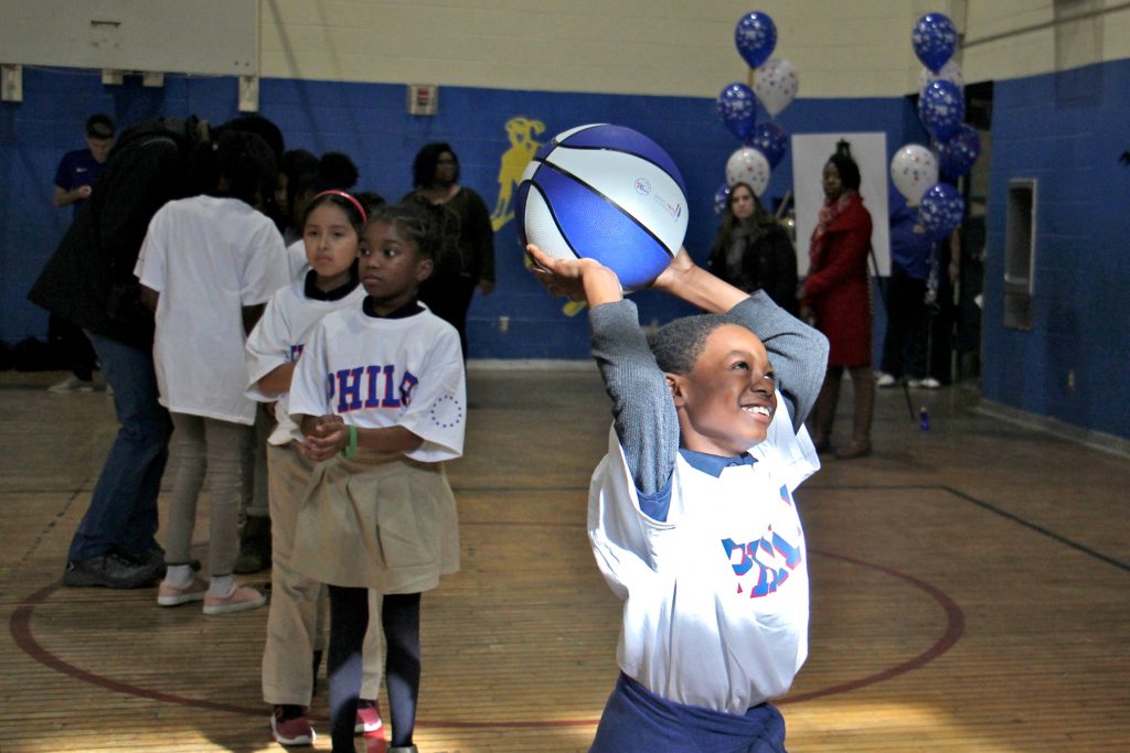 2018 01 19-e lee-terrsir smith-philadelphia hartranft school-positive behavioral intervention and supports pbis sixers Hartranft fourth-grader Terrsir Smith enjoys a basketball clinic put on by the Philadelphia 76ers at his school, a reward for positive behavior.