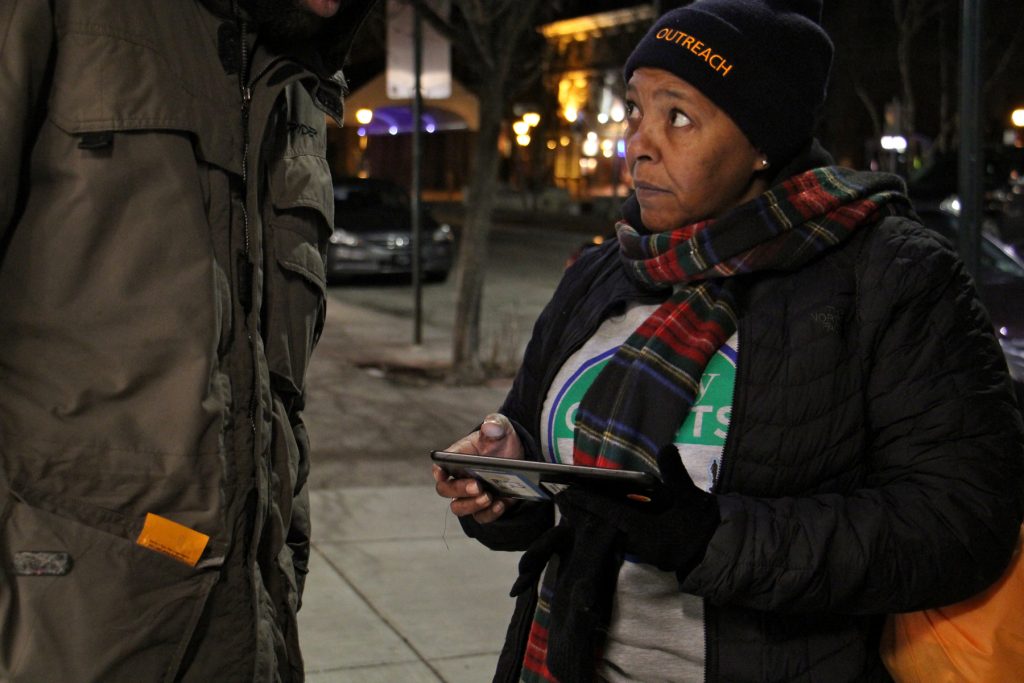 2018 01 25-e lee-monique taylor-philadelphia headhouse square-homeless count Monique Taylor interviews a homeless man near Headhouse Square for the 2018 homeless census. Like many of the volunteers who fanned out across the city Wednesday night, Taylor has experienced homelessness.