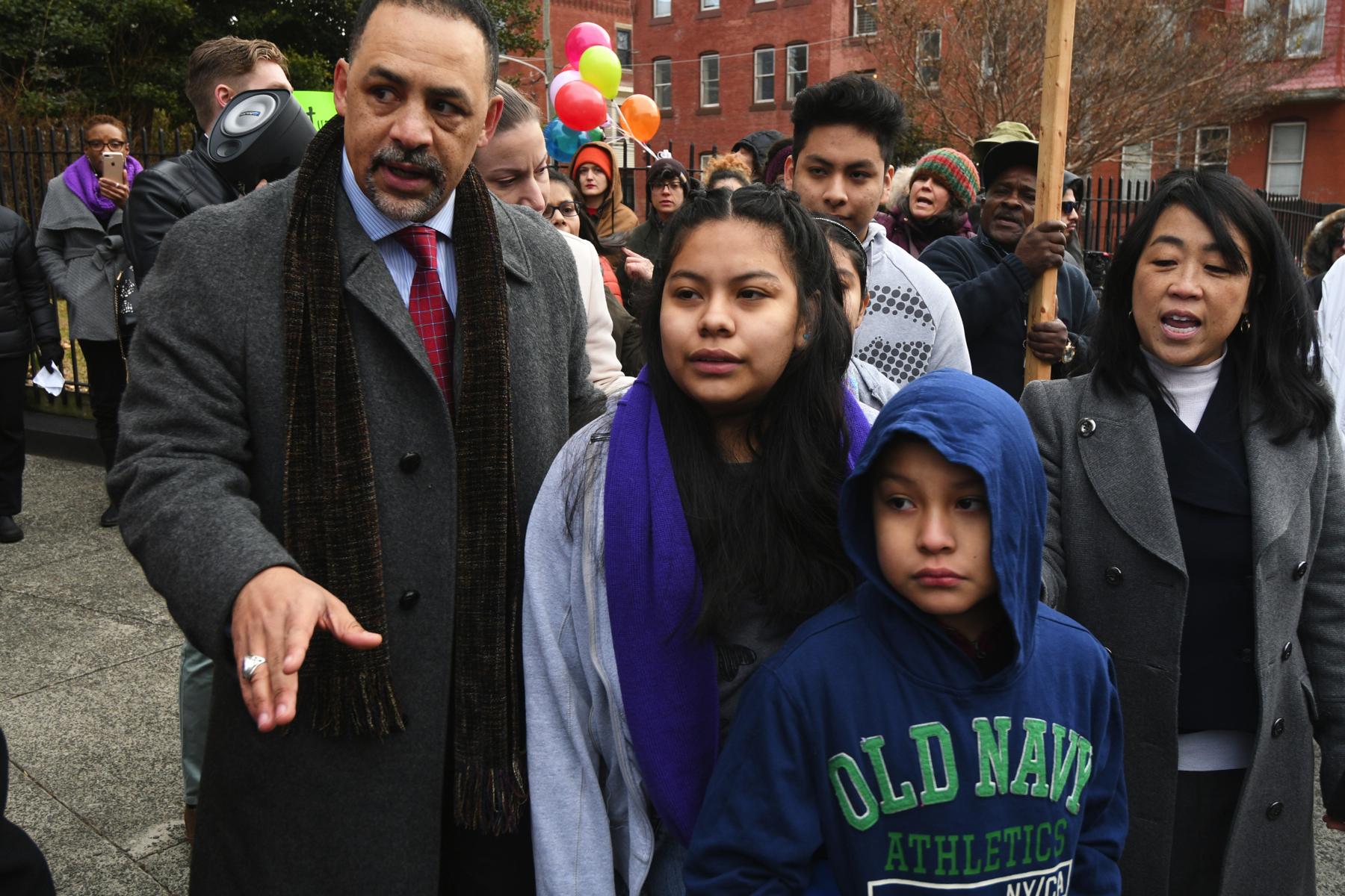 State Rep. Chris Rabb and Councilwoman Helen Gym walk with the four undocumented children of Camela Apolonio Hernandez as they leave sanctuary at Church of the Advocate in North Philadelphia.