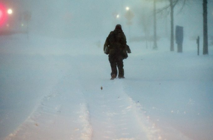 With heavy snow covering the roads in Sussex County, Delaware, some opted to travel by foot. (Chuck Snyder/for WHYY)